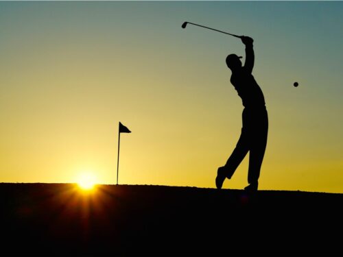 Silhouette of a golfer taking a swing near Shoshone Rose Casino & Hotel